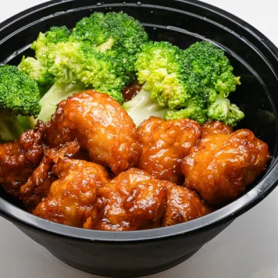 orange chicken stir fry in glossy orange sauce