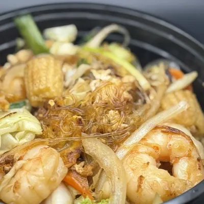 clear glass noodles stir fried with cabbage, broccoli and carrot